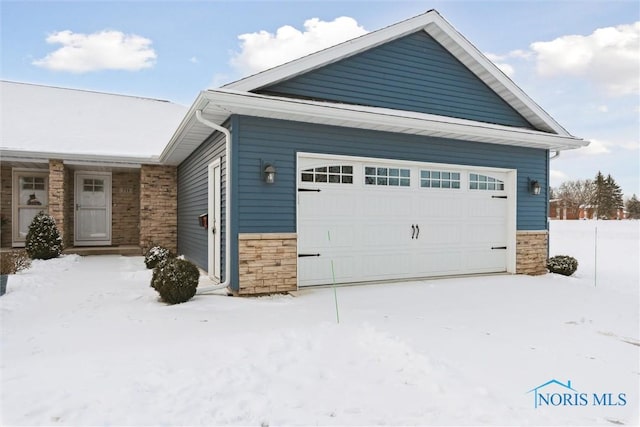 exterior space featuring stone siding