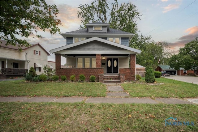 view of front of home featuring a yard