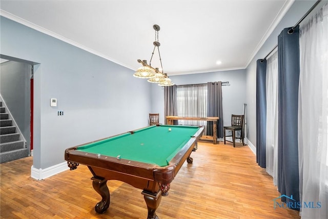 recreation room with crown molding, pool table, and light wood-type flooring