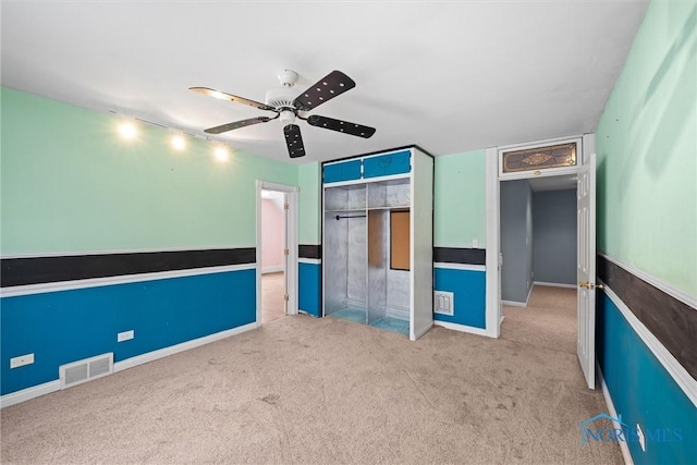 interior space featuring ceiling fan