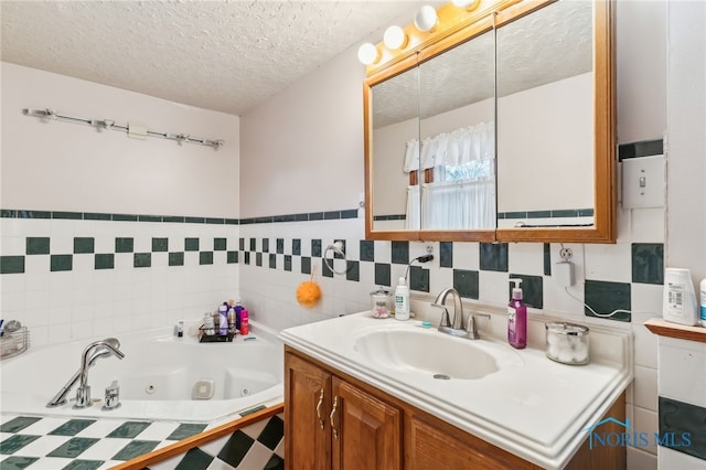 615 Lincolnshire Ln, Findlay, OH 45840 - bathroom featuring vanity, tiled bath, and a textured ceiling
