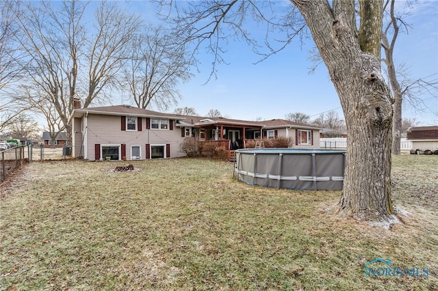 615 Lincolnshire Ln, Findlay, OH 45840 - rear view of house with a yard