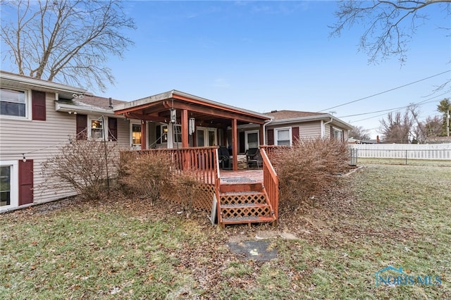 615 Lincolnshire Ln, Findlay, OH 45840 - rear view of house featuring a deck and a lawn