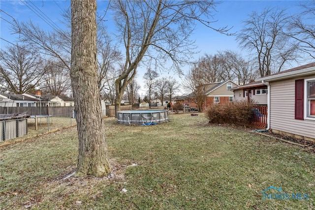 615 Lincolnshire Ln, Findlay, OH 45840 - view of yard featuring a fenced in pool and a trampoline