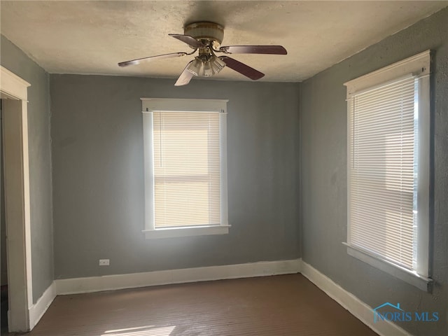 spare room featuring ceiling fan