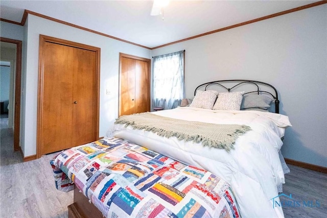 bedroom with crown molding, ceiling fan, and hardwood / wood-style floors