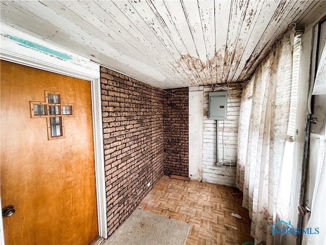 12356 Sylvania Metamora Rd, Berkey, OH 43504 - corridor featuring wooden ceiling, brick wall, electric panel, and light parquet floors