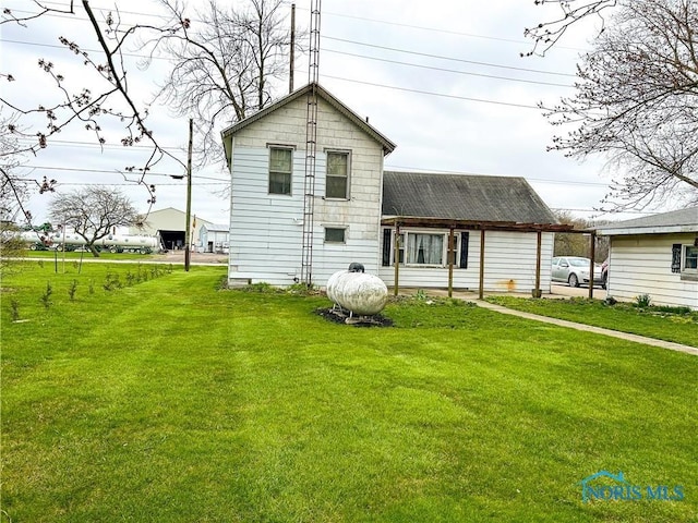 12356 Sylvania Metamora Rd, Berkey, OH 43504 - back of property featuring a lawn