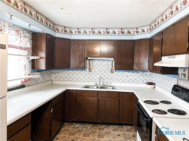 12356 Sylvania Metamora Rd, Berkey, OH 43504 - kitchen featuring dark brown cabinetry, sink, and electric range