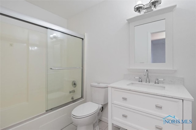 full bathroom with vanity, enclosed tub / shower combo, and toilet