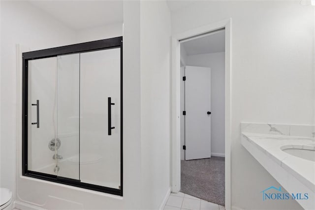 full bathroom with vanity, enclosed tub / shower combo, and toilet