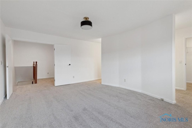 empty room featuring light colored carpet