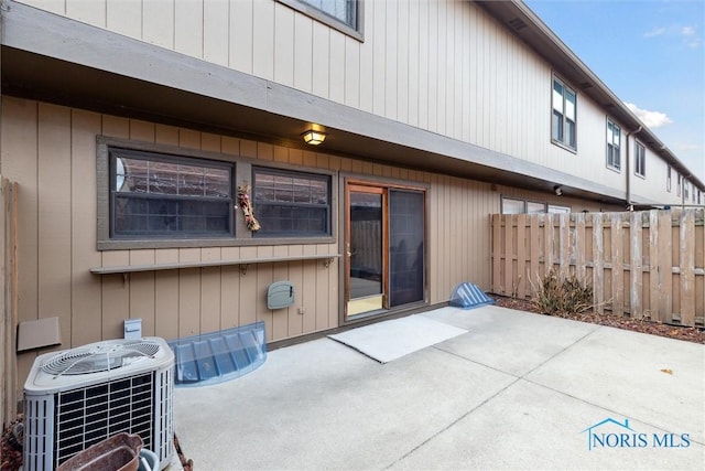 back of house featuring central AC unit and a patio area