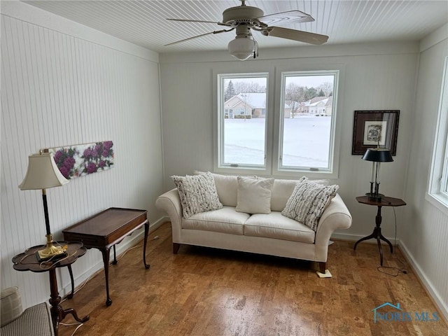 living room featuring ceiling fan, hardwood / wood-style flooring, and a healthy amount of sunlight