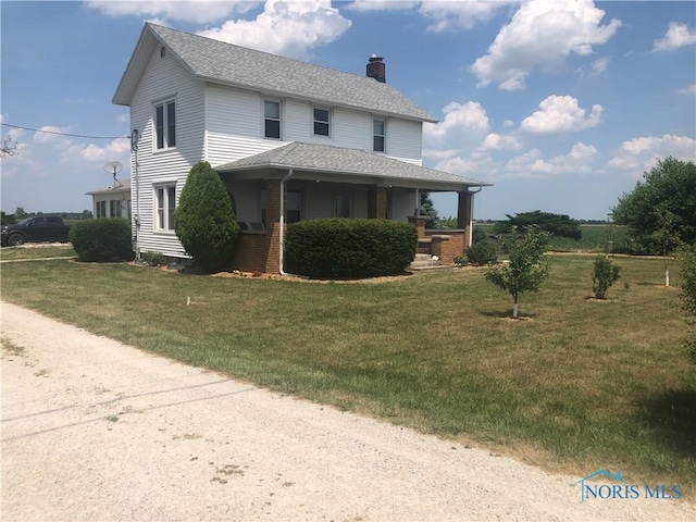 11608 Reitz Rd, Perrysburg, OH 43551 - view of front of house with a shingled roof, a chimney, and a front lawn