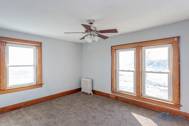 11608 Reitz Rd, Perrysburg, OH 43551 - empty room with carpet, baseboards, ceiling fan, and radiator heating unit