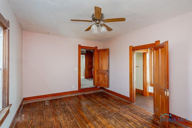 11608 Reitz Rd, Perrysburg, OH 43551 - spare room featuring dark wood-style floors, baseboards, and a ceiling fan