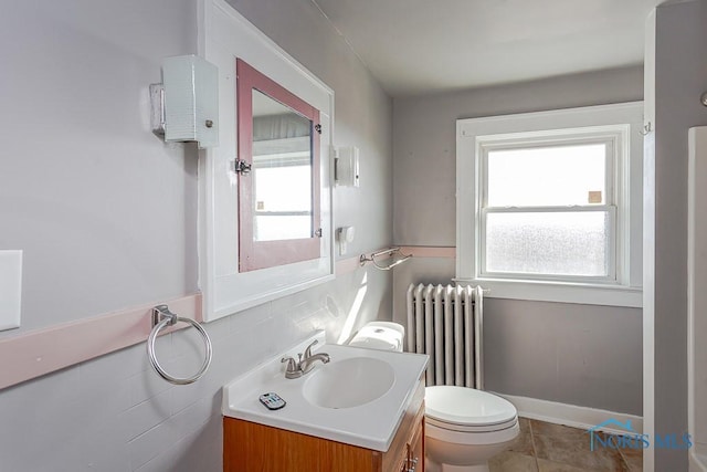11608 Reitz Rd, Perrysburg, OH 43551 - half bath featuring tile walls, toilet, radiator heating unit, vanity, and tile patterned flooring