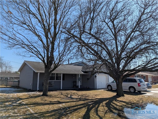 single story home featuring a garage and driveway