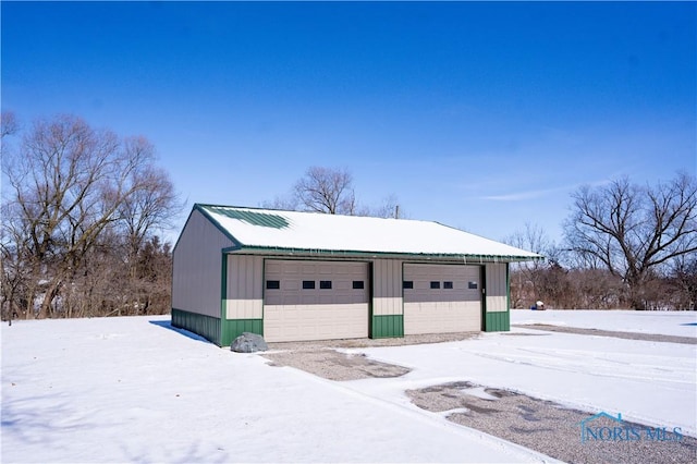 view of snow covered garage