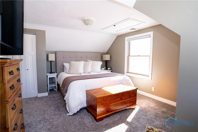 carpeted bedroom featuring vaulted ceiling