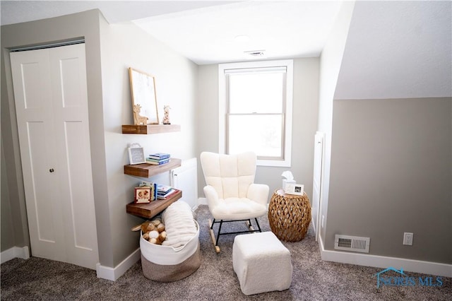 sitting room featuring carpet floors