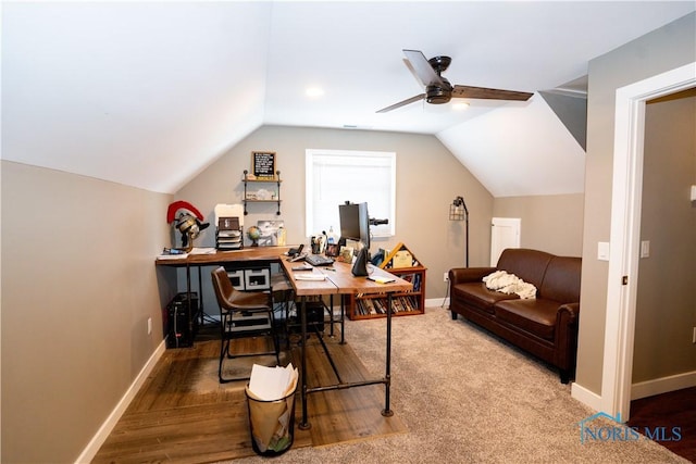 office space with lofted ceiling, ceiling fan, and hardwood / wood-style flooring