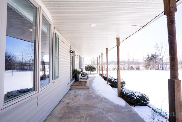 view of snow covered patio