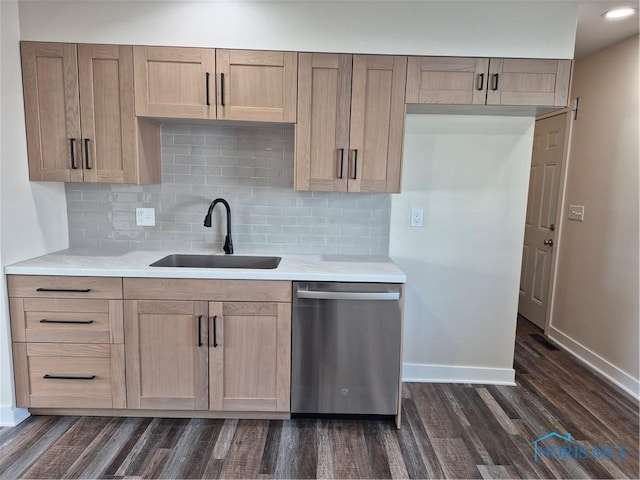 kitchen featuring stainless steel dishwasher, decorative backsplash, sink, and dark hardwood / wood-style floors