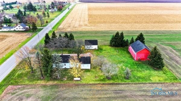 birds eye view of property with a rural view