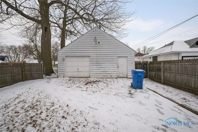 view of snow covered garage