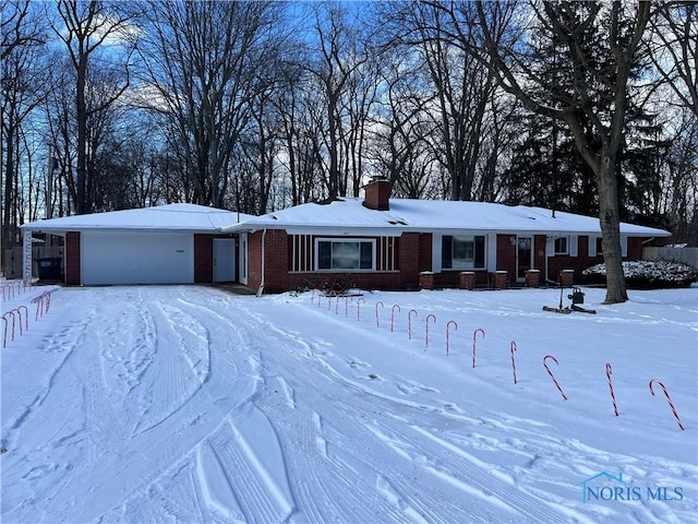 single story home featuring a garage