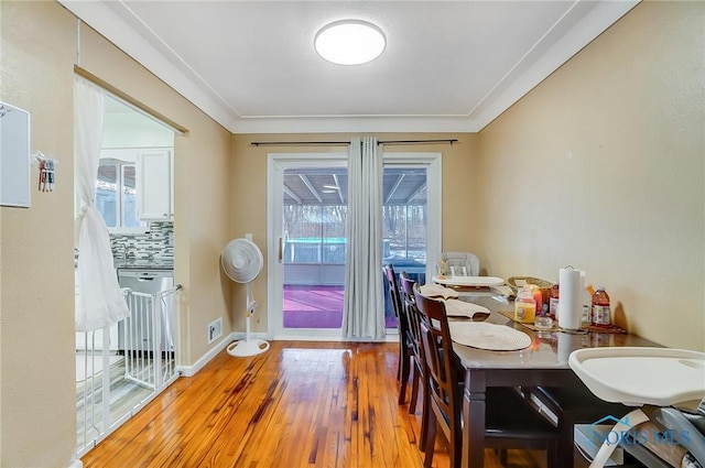 4811 Larkhaven Dr, Toledo, OH 43623 - dining space featuring healthy amount of natural light, hardwood / wood-style flooring, baseboards, and ornamental molding