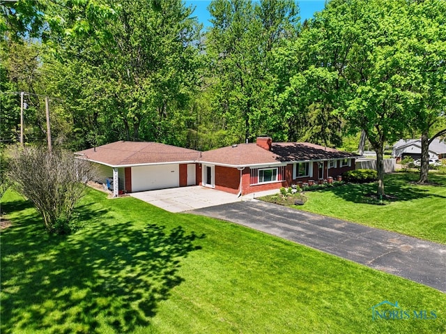 4811 Larkhaven Dr, Toledo, OH 43623 - ranch-style house featuring asphalt driveway, brick siding, a garage, and a chimney