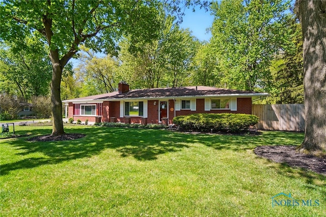 4811 Larkhaven Dr, Toledo, OH 43623 - ranch-style house with a chimney and brick siding
