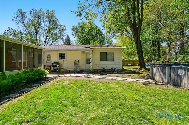 4811 Larkhaven Dr, Toledo, OH 43623 - back of house featuring a covered pool and a sunroom