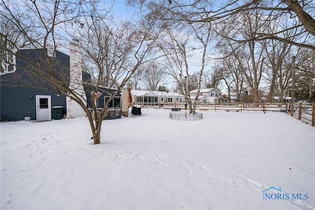 view of yard covered in snow