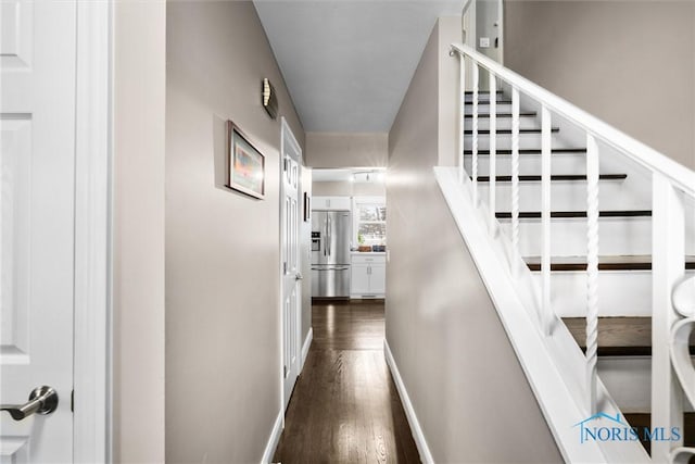 hall with dark wood-type flooring