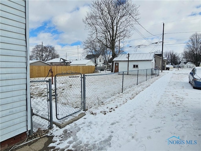 view of yard layered in snow