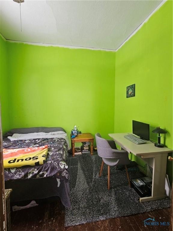 bedroom featuring hardwood / wood-style floors