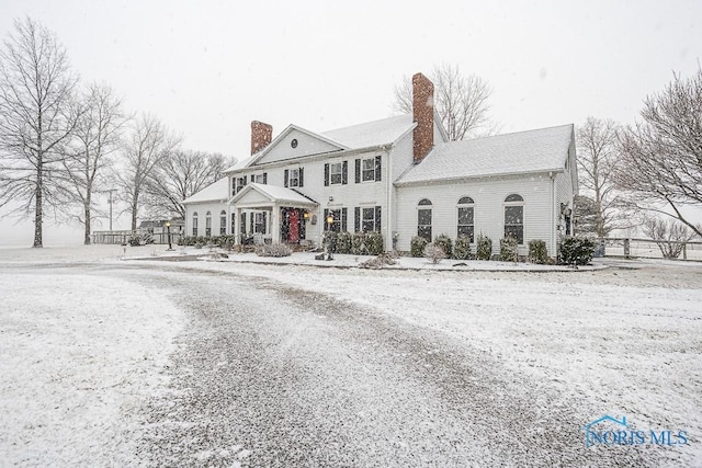 view of front of house featuring a chimney