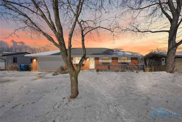 view of front of property with brick siding and an attached garage