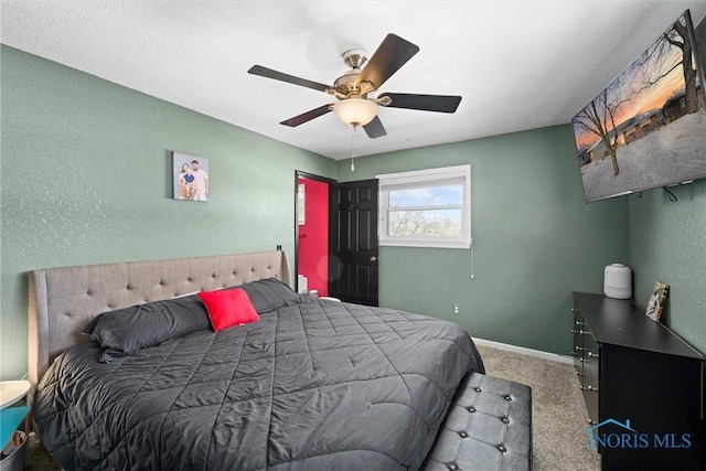 bedroom featuring ceiling fan, baseboards, and carpet flooring