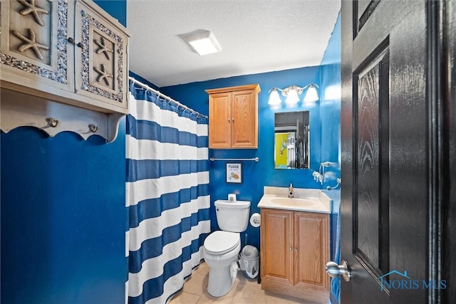 full bath featuring curtained shower, toilet, a textured ceiling, vanity, and tile patterned flooring