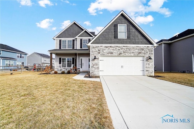 craftsman house with covered porch, stone siding, a front lawn, and driveway