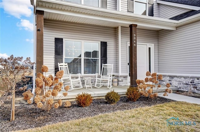 entrance to property featuring covered porch