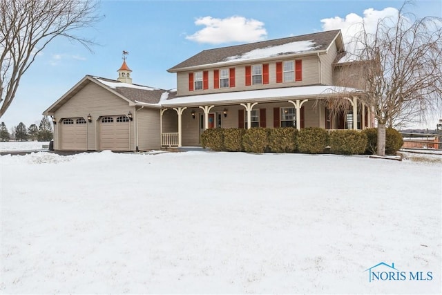 view of front facade with a garage and covered porch