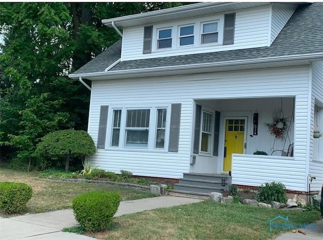 view of front of home with a shingled roof