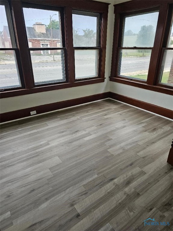 unfurnished room featuring light hardwood / wood-style floors