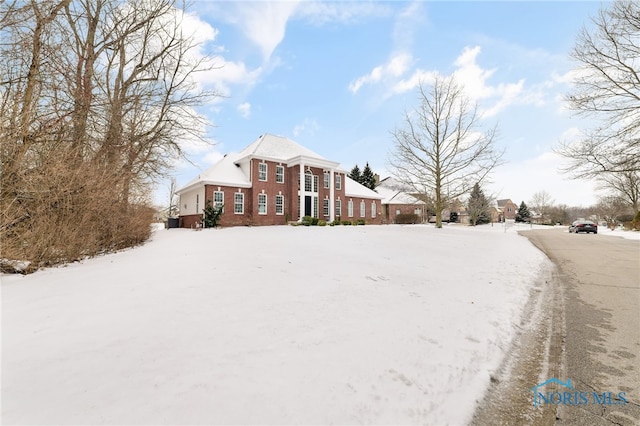 view of front of property featuring brick siding